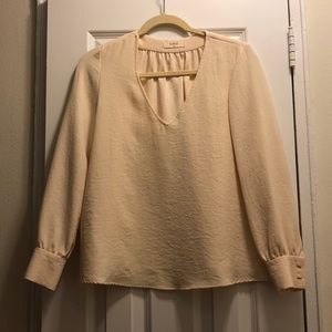 Free flowing cream colored blouse